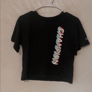 black shirt with rainbow champion letters